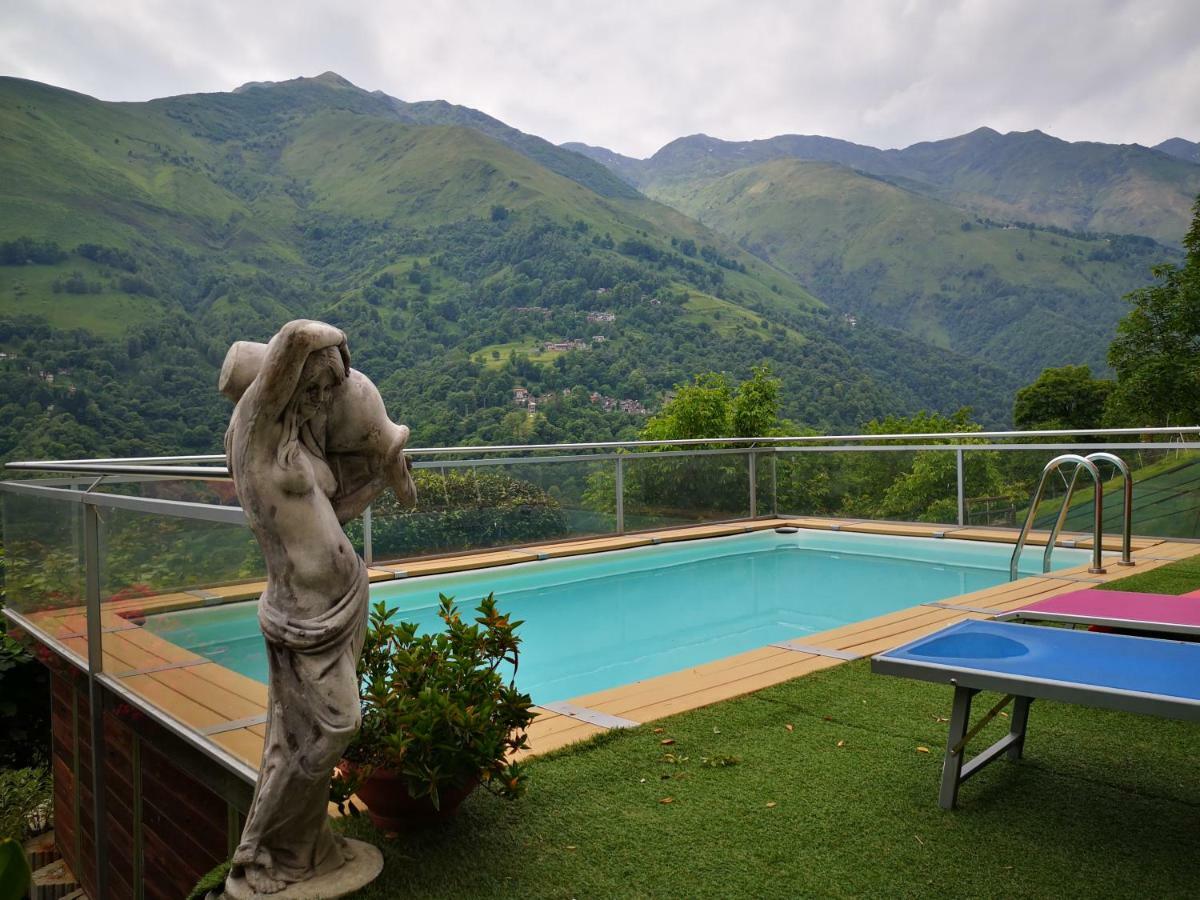 Chalet Con Piscina Garzeno Exterior photo